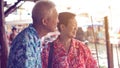 Chinese elderly couple travel to Thailand floating market retirement fun trip Royalty Free Stock Photo