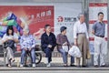 Chinese elderly waiting at a bus stop, Shanghai, China