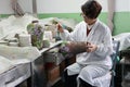 Chinese enamel handycraft worker in factory