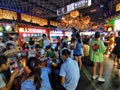 Chinese enjoying snacks at indoor food stalls in wuhan city