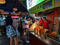 Chinese enjoying snacks at indoor food stalls in wuhan city