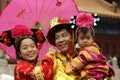 Chinese family dressed with traditional garments visit Forbidden City in Bejing