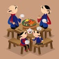 A Chinese family enjoys eating walled village dish Poon Choi Royalty Free Stock Photo