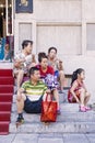 Chinese family having a break in Qianmen street, Beijing, China