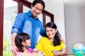 Chinese family learning mathematics with her child Royalty Free Stock Photo