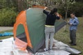 Family pitch a tent