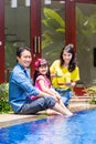 Chinese Family at pool in front of home Royalty Free Stock Photo