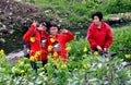 Chinese Family in Rapeseed Flower Field