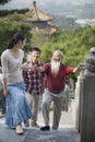 Chinese Family Walking In Jing Shan Park