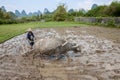 Chinese farmer ploughing with asian buffalo