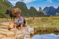 Chinese farmer with water buffalo, China. Royalty Free Stock Photo