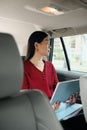 Chinese Business Woman Working In Taxi Going To Work Royalty Free Stock Photo