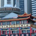Chinese ferry in front of OUE tower Royalty Free Stock Photo