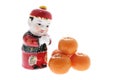 Chinese Figurine and Mandarins Royalty Free Stock Photo