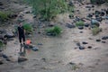 Chinese fisherman in a shallow river