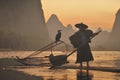 Chinese fisherman from the Xing Ping area fishing with nets and cormorants