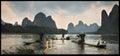 Chinese fishermen on the boat in mountains