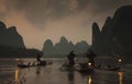 Chinese fishermen on the boat in mountains