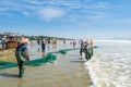 Chinese fishermen pulling the fishnet at the sea in Xitou Yangjiang, Guangdong, China