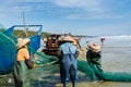 Chinese fishermen pulling the fishnet at the sea in Xitou Yangjiang, Guangdong, China