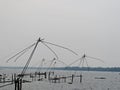 Chinese fishing net poles in the backwaters of Kerala, India Royalty Free Stock Photo