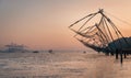 Chinese fishing nets during the Golden Hours at Fort Kochi, Kerala, India sunrise fisherman work
