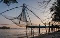 Chinese fishing nets during the Golden Hours at Fort Kochi, Kerala, India sunrise fisherman work Royalty Free Stock Photo