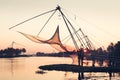 Chinese fishing nets on sunset background in Cochin, Kerala, Ind