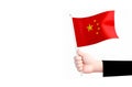 Chinese flag in handon white background.China symbol.ai generated Royalty Free Stock Photo