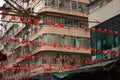 Chinese Flags Hanging Above Hong Kong Street