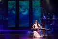 Chinese folk music performer playing Guzheng