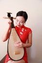 Chinese folk music performer playing Pipa Royalty Free Stock Photo