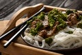 Chinese food - beef prepared with broccoli and rice noodles. Royalty Free Stock Photo