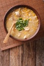 Chinese food: corn soup with chicken and onions close-up. vertical top view Royalty Free Stock Photo