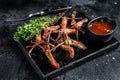 Chinese food dip fried duck tongue Black background. Top view Royalty Free Stock Photo
