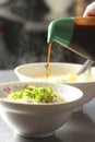 Chinese food, fried noodle add black rice vinegar Royalty Free Stock Photo