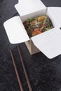 Chinese Food of Sweet and Sour, Orange or Lemon Chicken - in a Take Out Container with chopsticsk Royalty Free Stock Photo