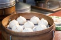 Chinese food steamed bun in bamboo basket in food market
