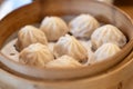 Chinese food, steamed hot Xiaolongbao in bamboo steaming basket. Royalty Free Stock Photo