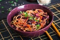 Chinese food. Vegan stir fry noodles with red cabbage and carrot