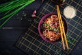 Chinese food. Vegan stir fry noodles with red cabbage and carrot