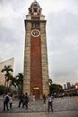 ChinChinese and foreigners people travel visit at square of Former Kowloon - Canton Railway Clock Tower in Hong Kong, China Royalty Free Stock Photo