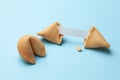 Chinese fortune cookies. Cookies with empty blank inside for prediction words. Blue background Royalty Free Stock Photo