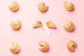 Chinese fortune cookies. Cookies texture pattern with empty blank inside for word prediction. Pink background. Royalty Free Stock Photo