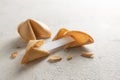 Chinese fortune cookies, one is cracked with blank paper slip for the prediction on a light background with copy space Royalty Free Stock Photo