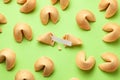 Chinese fortune cookies. Cookies texture pattern with empty blank inside for word prediction. Green background Royalty Free Stock Photo