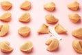 Chinese fortune cookies. Cookies texture pattern with empty blank inside for word prediction. Pink background Royalty Free Stock Photo