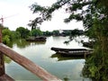 Chinese frame. Boats, lake, nature, village and development Royalty Free Stock Photo