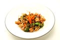 The Chinese fried noodles with squids, an octopus and vegetables. Royalty Free Stock Photo