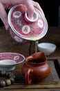 A chinese gaiwan with tea on a tea table